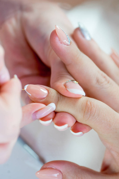 nail care and manicure in a nail salon - 写真・画像
