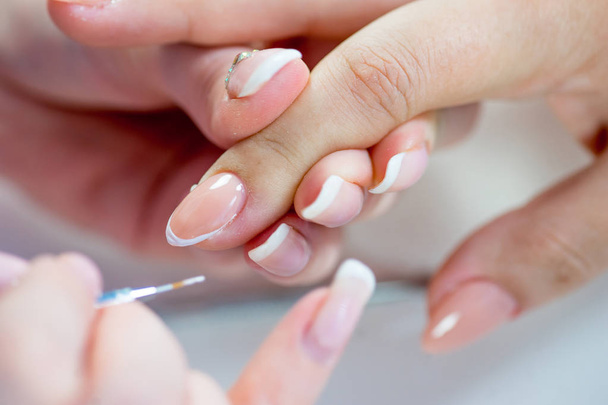 nail care and manicure in a nail salon - Fotó, kép