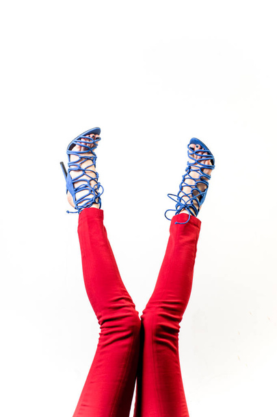 Female legs in red trousers and shoes - Foto, immagini
