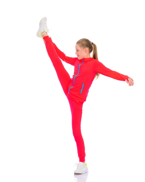The gymnast perform an acrobatic element. - Zdjęcie, obraz