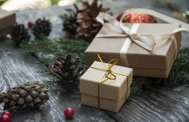 Christmas gift boxes on a rustic wooden background - 写真・画像