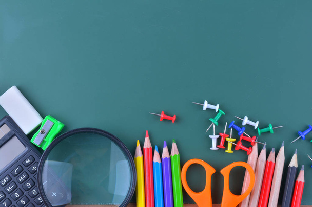School supplies on chalkboard - Photo, Image