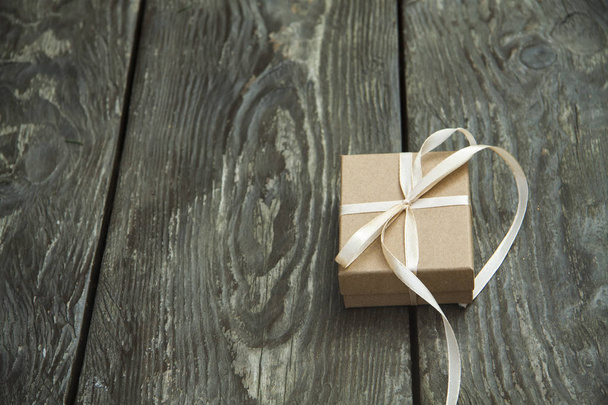 Christmas gift boxes on a rustic wooden background - Photo, Image