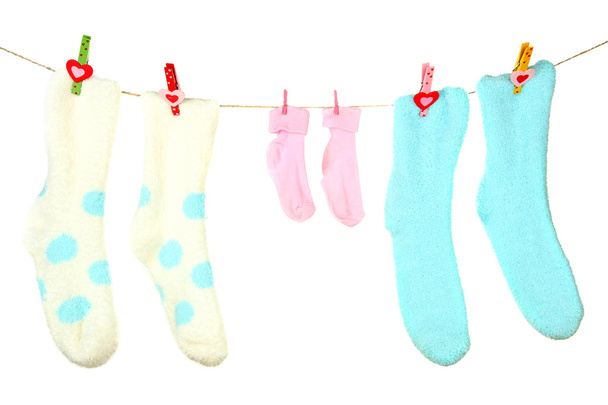 Colorful socks hanging on clothesline, isolated on white - Photo, image