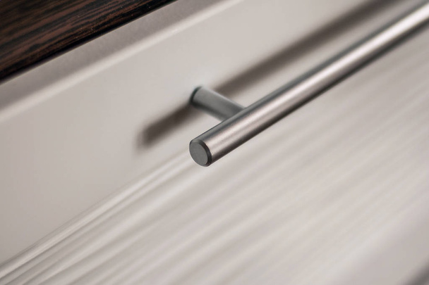 Beautiful and diverse subject. Beautiful metal straight cylindrical handle for furniture. - Valokuva, kuva