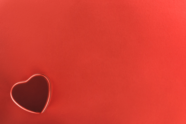 view from above of heart shaped present box isolated on red, st valentine day concept - Φωτογραφία, εικόνα