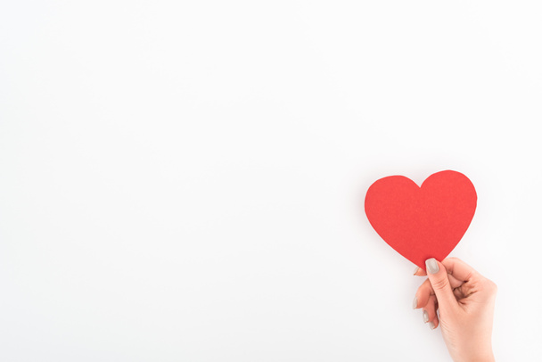 cropped shot of woman holding red heart symbol isolated on white, st valentine day concept - 写真・画像