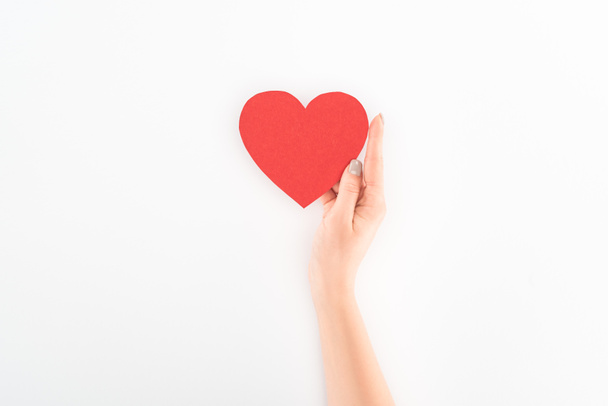 cropped shot of woman holding red heart symbol isolated on white, st valentine day concept - 写真・画像