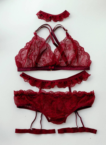 Red lacy lingerie on white background. - Photo, Image