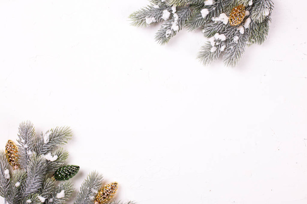 festive winter holidays composition with fir tree branches and christmas decorations - Photo, Image