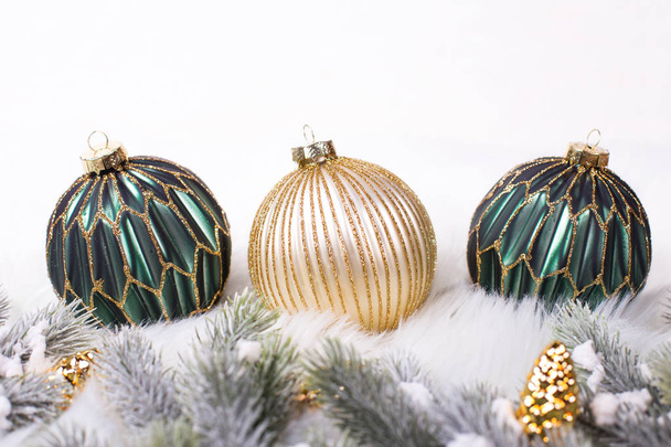 arranged green and golden christmas decorative balls, winter holidays concept - Photo, Image