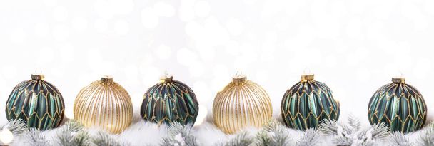 arranged green and golden christmas decorative balls, winter holidays concept - Φωτογραφία, εικόνα