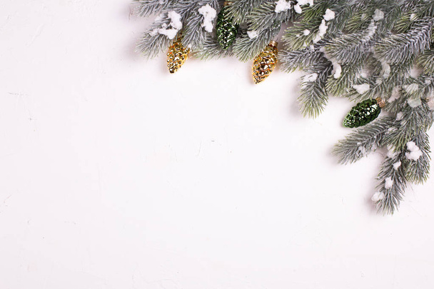 festive winter holidays composition with fir tree branches and christmas decorations - Photo, image