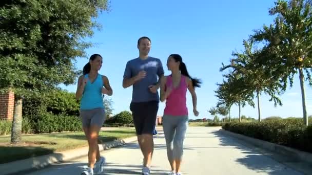 Young Running Partners on Suburban Roads - Footage, Video