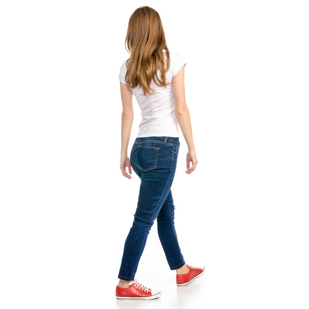 Woman in jeans and t-shirt runs goes - Fotó, kép