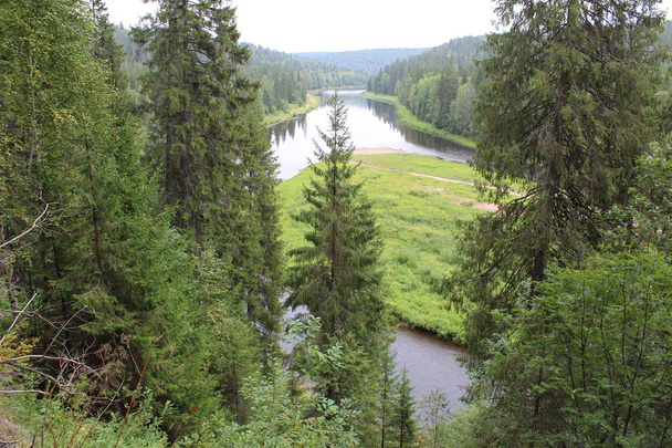 beautiful Ural landscape river and mountain View / beautiful landscape in the Perm region where the Usva river flows.Along the riverbank mountains, forests, glades.Water with fast current.The Ural river is very picturesque.Photo of Russian nature. - Photo, Image