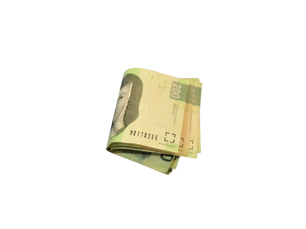 Három hajtva és csoportosított Mexikói peso 200 számlák elszigetelt fehér background - Fotó, kép