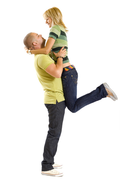 Man holding his girlfriend in the air - Foto, imagen
