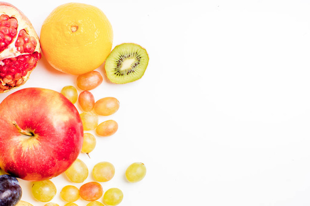 Creative layout made of fruits on a white background - Foto, afbeelding