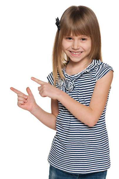 Laughing girl shows her fingers to the side - Foto, imagen
