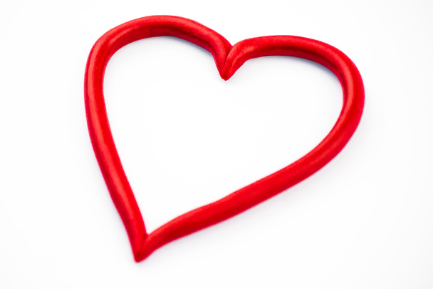 Primer plano del símbolo del corazón. Símbolo del amor, día de San Valentín. El fondo es blanco. Espacio de copia
 - Foto, imagen