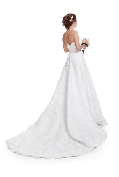 Beautiful bride in luxurious wedding dress with train isolated o - Фото, зображення