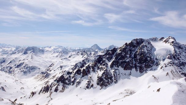 winter mountain landscape in the Silvretta mountain range in the Swiss Alps between Scuol and Ischgl - Photo, Image