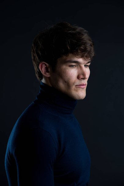 Portrait of young handsome man in a photographic studio - Фото, зображення