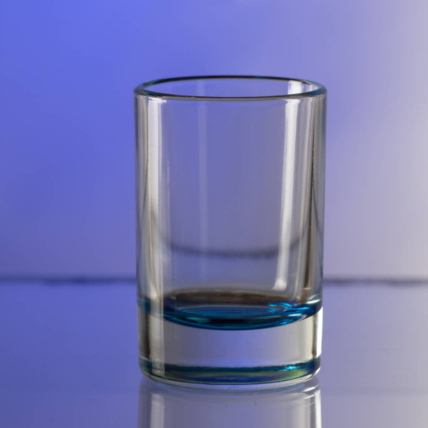 Empty glass on a colorful background close up - Photo, Image