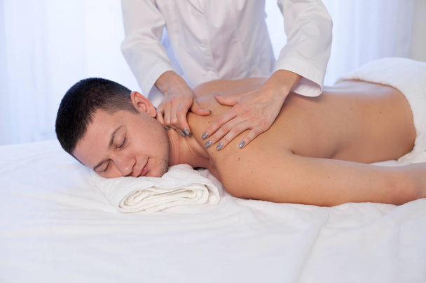 male massage therapist make therapeutic massage and body therapy Spa - Photo, Image
