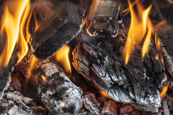 burning coals and flames background in the grill. - Photo, Image