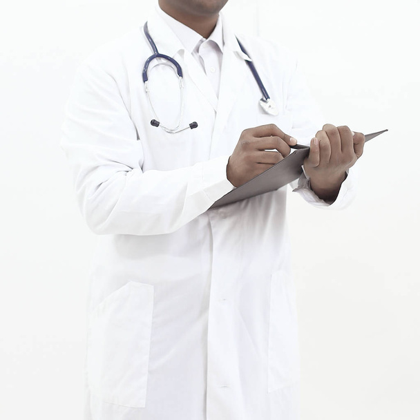 General practitioner writing a prescription.isolated on white - Φωτογραφία, εικόνα