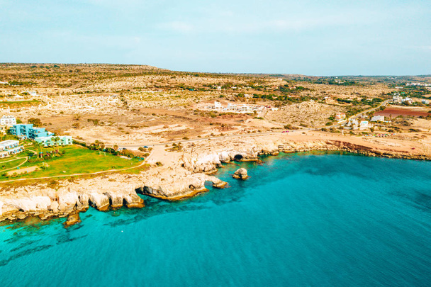 Beautiful Cyprus, Konnos Bay in Cape Greko natural park, rock arch near of Ayia Napa and promenade (molos) Limassol Cyprus and aerial photo of Limassol  - Fotó, kép