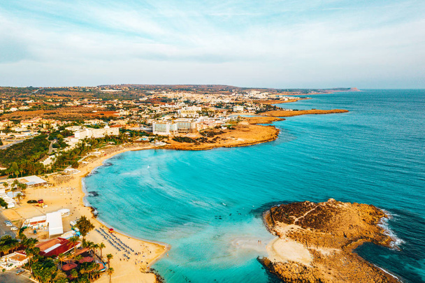 Nissi beach in Ayia Napa, clean aerial photo of famous tourist beach in Cyprus. The best resort area of Cyprus, Nissi beach, the hotels, gulfs, parks. - Фото, изображение