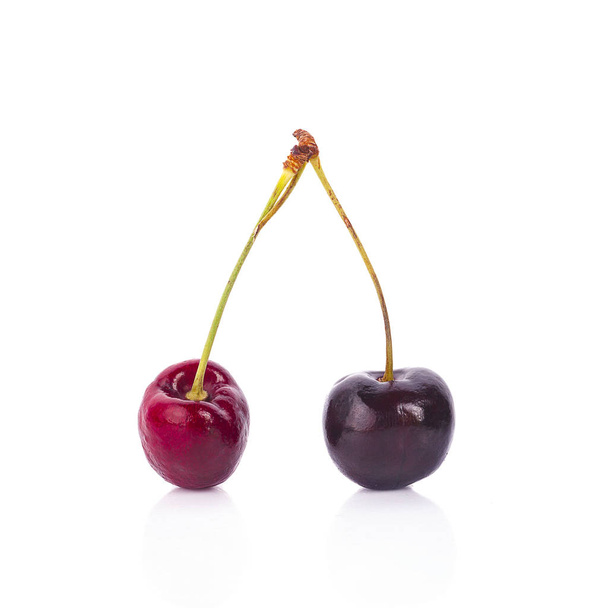 Fresh red cherry isolated on white background - Foto, afbeelding