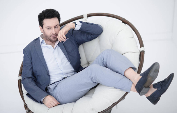 close up.tired businessman resting in a comfortable chair - Φωτογραφία, εικόνα