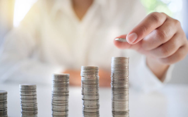 business woman stacking money coins, investment and banking concept - Photo, Image