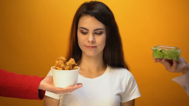 Girl choosing salad instead of fried meat, healthy food for weightloss, diet - Záběry, video
