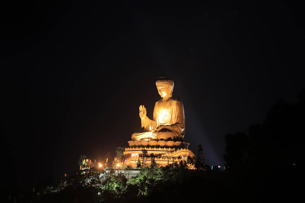 Te Tian Tan Buddha at night view
 - Фото, изображение