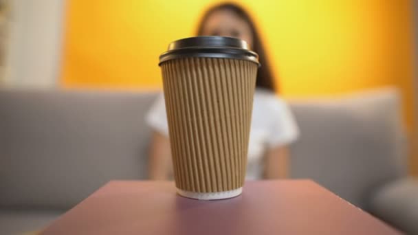 Person serving coffee to girl, caffeine addiction, morning energy booster - Felvétel, videó
