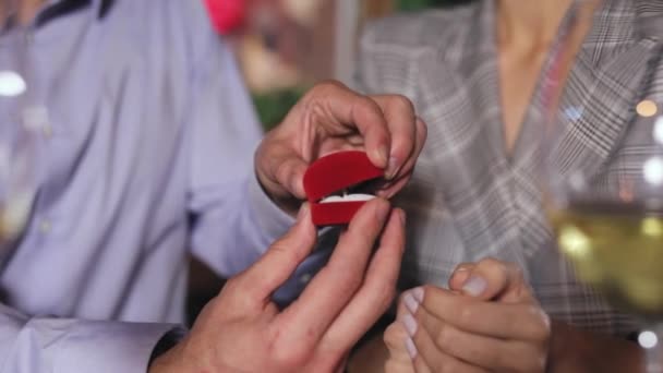Man Doing Marriage Proposal To Woman In Restaurant Closeup - Filmati, video