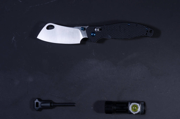 Knife and travel accessories. Flint and whistle. - Photo, Image
