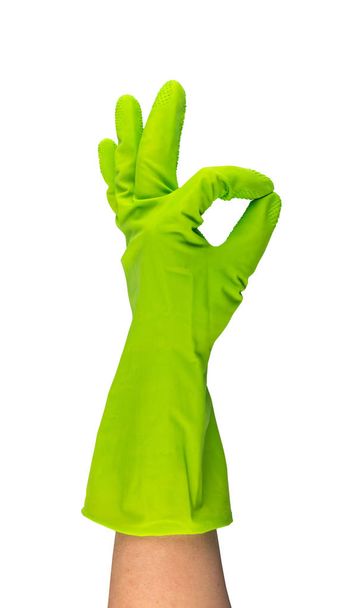 Hand in green protective rubber glove isolated on white background with clipping path. Raised gloved hand with okay gesture - Photo, Image