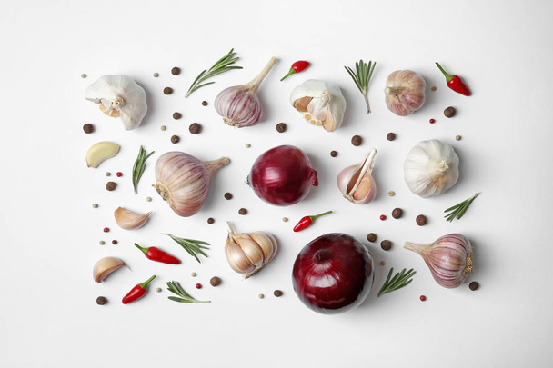 Composition with garlic, peppers and onions on white background, top view - Foto, Imagem