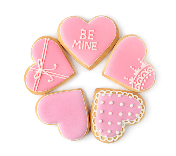 Decorated heart shaped cookies on white background, top view - Foto, afbeelding