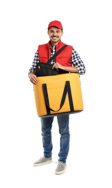 Young courier with thermo bag on white background. Food delivery service - Fotoğraf, Görsel