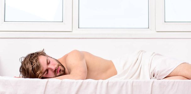 Man handsome guy sleep. Sleep is vital to your physical and mental health. Healthy sleep habits. Man unshaven bearded face sleep bed. Time for nap. Sleep and relax concept. Feel comfortable and rela - Фото, изображение