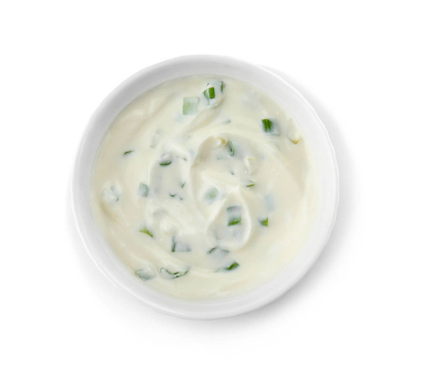 Bowl with sour cream and herbs on white background, top view - Photo, Image