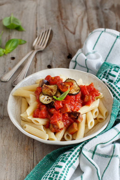 Penne alla norma  - traditional italian pasta with eggplants and tomatoes - Photo, Image