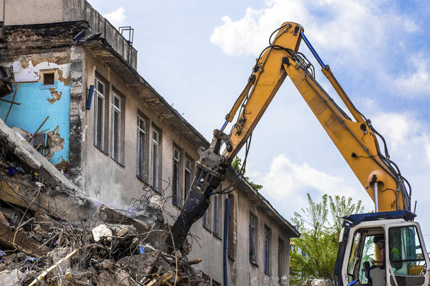 demolition of a building with a hydraulic excavator - Photo, Image
